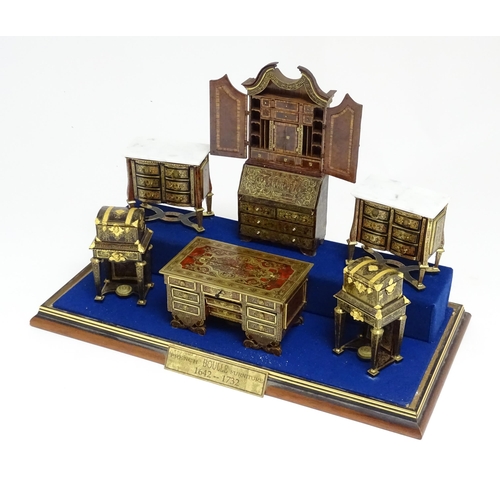 1497 - A showcase containing a display of early 21stC scale model miniature models of furniture to include ... 