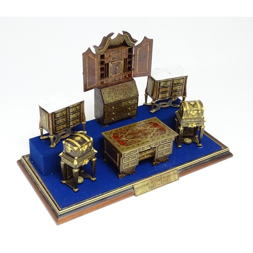 1497 - A showcase containing a display of early 21stC scale model miniature models of furniture to include ... 