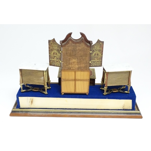 1497 - A showcase containing a display of early 21stC scale model miniature models of furniture to include ... 