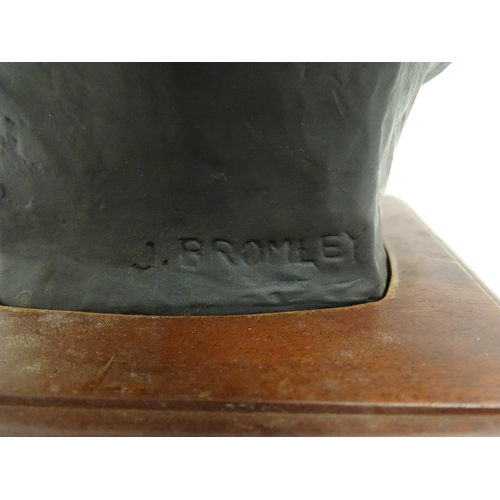 1504 - A basalt bust depicting Sir Winston Churchill by John Bromley, titled under and signed to reverse. R... 