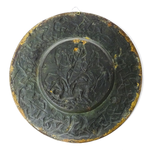 1507 - A large 20thC brass charger with relief decoration depicting Roman soldiers in battle, possibly depi... 