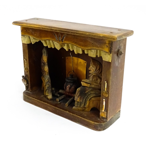 1509 - An early 20thC Continental folk art diorama depicting a naive carved interior scene with man and wom... 