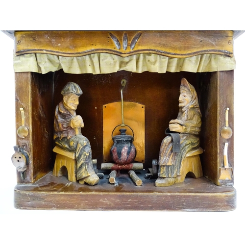 1509 - An early 20thC Continental folk art diorama depicting a naive carved interior scene with man and wom... 