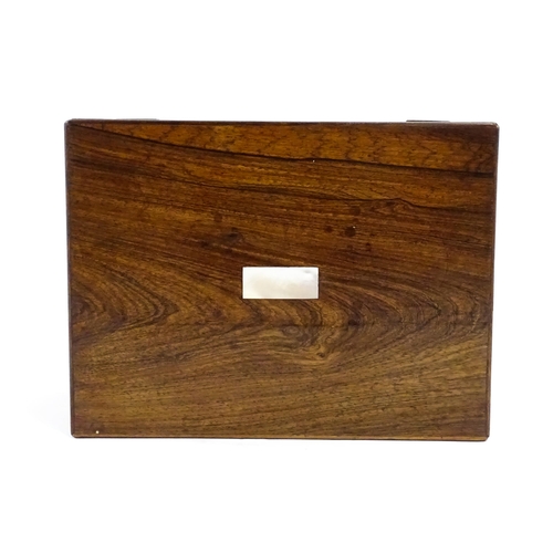 1511 - A Victorian rosewood work box with inlaid mother of pearl escutcheon detail, opening to reveal a fit... 