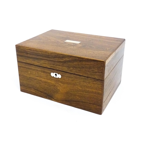 1511 - A Victorian rosewood work box with inlaid mother of pearl escutcheon detail, opening to reveal a fit... 