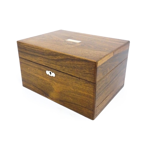 1511 - A Victorian rosewood work box with inlaid mother of pearl escutcheon detail, opening to reveal a fit... 