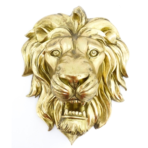 1516 - An early 21stC gilt wall hanging lion head. Approx. 19