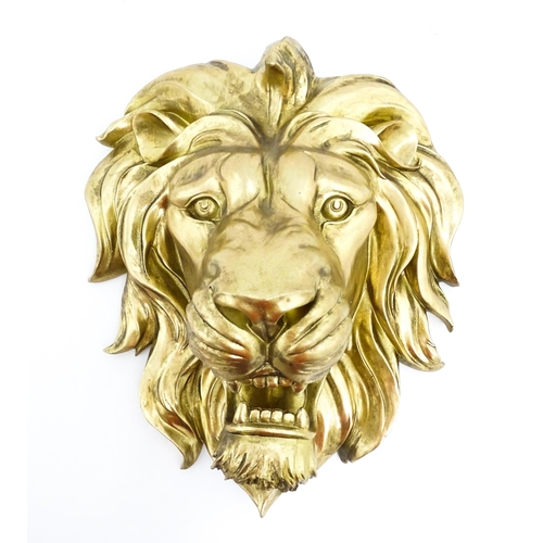 1516 - An early 21stC gilt wall hanging lion head. Approx. 19