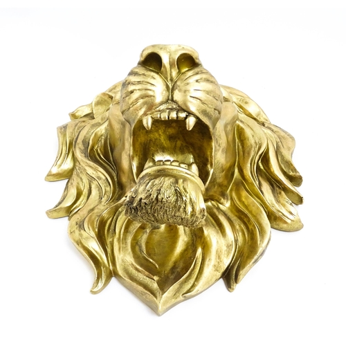 1516 - An early 21stC gilt wall hanging lion head. Approx. 19