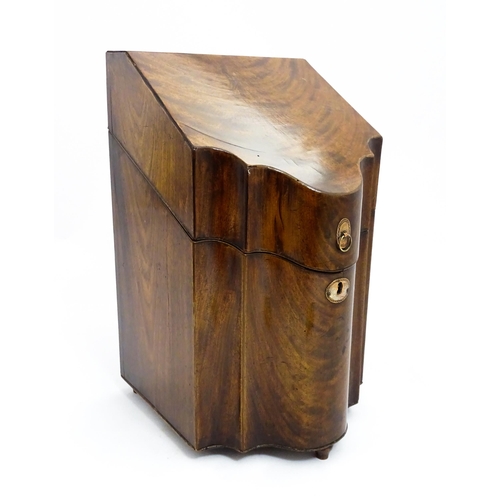 1518 - A 19thC mahogany knife box with a serpentine front opening to reveal a fitted interior, and raised o... 