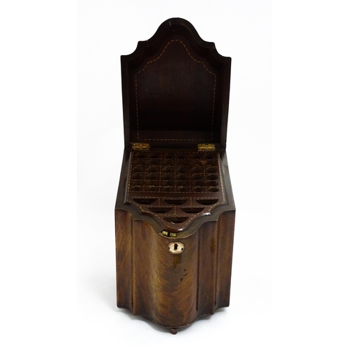 1518 - A 19thC mahogany knife box with a serpentine front opening to reveal a fitted interior, and raised o... 