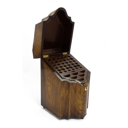 1518 - A 19thC mahogany knife box with a serpentine front opening to reveal a fitted interior, and raised o... 