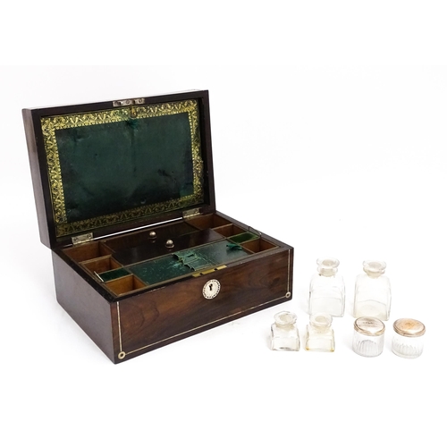 1536 - A Victorian rosewood dressing box with inlaid mother of pearl decoration, opening to reveal a fitted... 