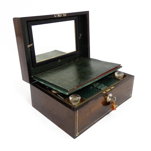 1536 - A Victorian rosewood dressing box with inlaid mother of pearl decoration, opening to reveal a fitted... 