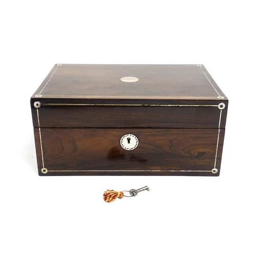 1536 - A Victorian rosewood dressing box with inlaid mother of pearl decoration, opening to reveal a fitted... 