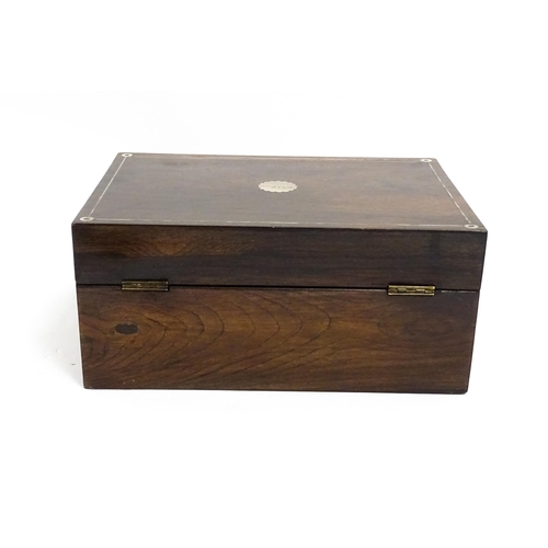 1536 - A Victorian rosewood dressing box with inlaid mother of pearl decoration, opening to reveal a fitted... 