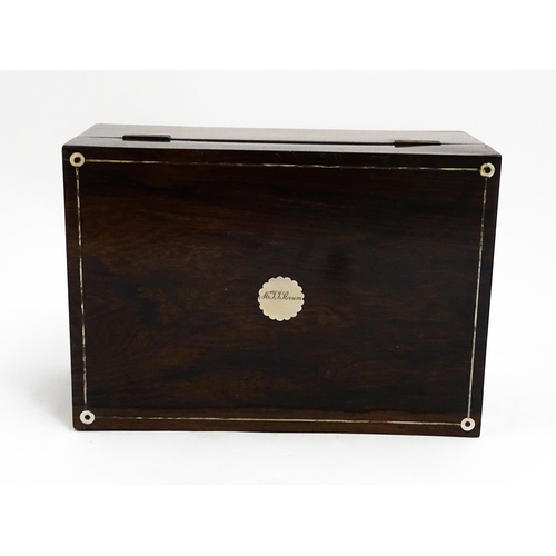 1536 - A Victorian rosewood dressing box with inlaid mother of pearl decoration, opening to reveal a fitted... 