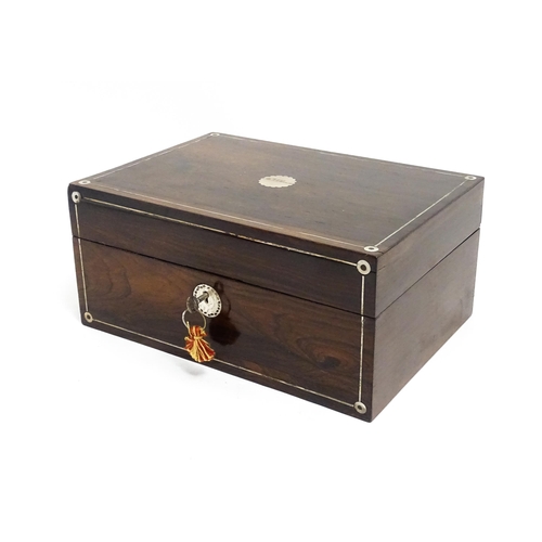 1536 - A Victorian rosewood dressing box with inlaid mother of pearl decoration, opening to reveal a fitted... 