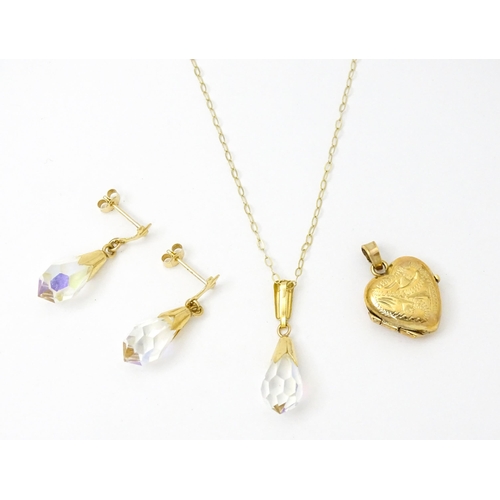 971 - A 9ct gold locket of heart form. Together with a pair of 9ct drop earrings, and an associated pendan... 