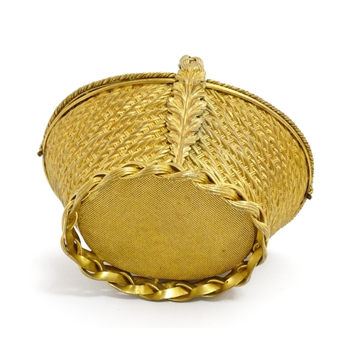 1445 - A 20thC gilt metal sewing / jewellery box of basket form with twin hinged lids each with a hand pain... 