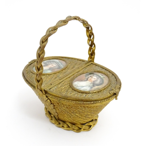 1445 - A 20thC gilt metal sewing / jewellery box of basket form with twin hinged lids each with a hand pain... 