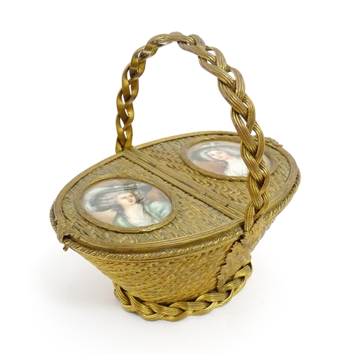 1445 - A 20thC gilt metal sewing / jewellery box of basket form with twin hinged lids each with a hand pain... 