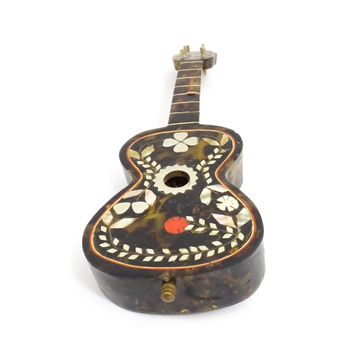 1447 - A 20thC Italian / Napoli souvenir music box modelled as a guitar with inlaid abalone decoration with... 