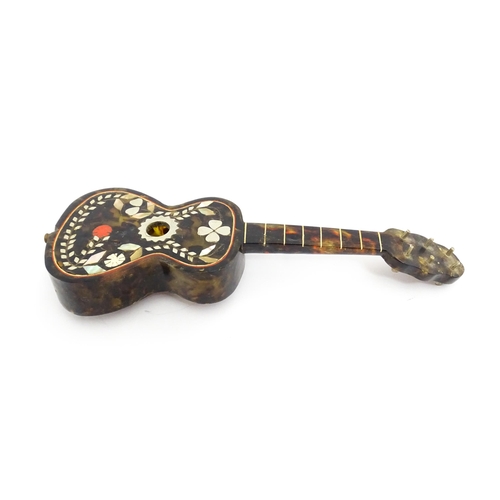 1447 - A 20thC Italian / Napoli souvenir music box modelled as a guitar with inlaid abalone decoration with... 