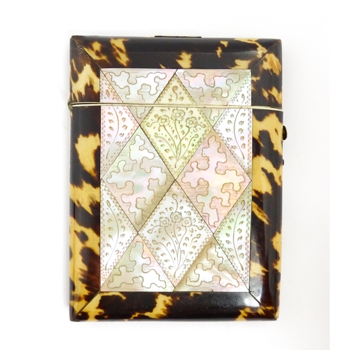 1450 - A Victorian tortoiseshell and mother of pearl card case with engraved floral decoration. Approx. 4