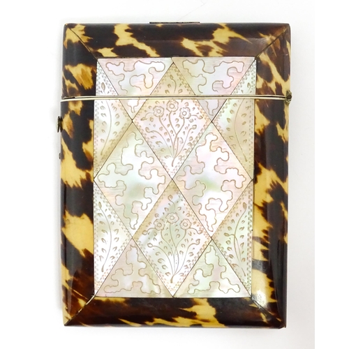 1450 - A Victorian tortoiseshell and mother of pearl card case with engraved floral decoration. Approx. 4