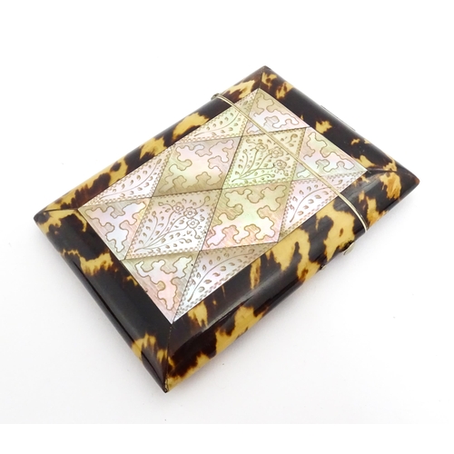 1450 - A Victorian tortoiseshell and mother of pearl card case with engraved floral decoration. Approx. 4