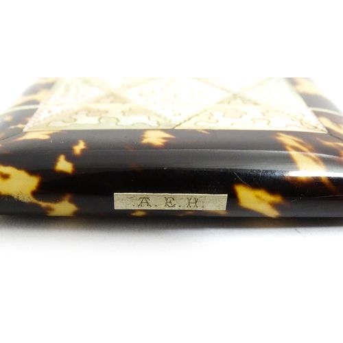 1450 - A Victorian tortoiseshell and mother of pearl card case with engraved floral decoration. Approx. 4