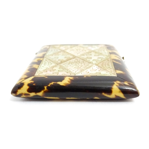 1450 - A Victorian tortoiseshell and mother of pearl card case with engraved floral decoration. Approx. 4