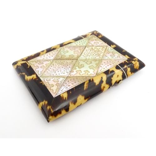 1450 - A Victorian tortoiseshell and mother of pearl card case with engraved floral decoration. Approx. 4