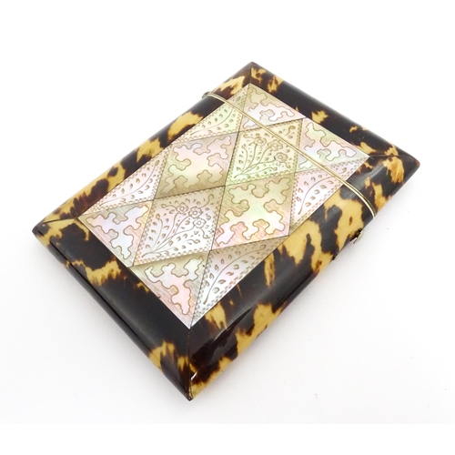 1450 - A Victorian tortoiseshell and mother of pearl card case with engraved floral decoration. Approx. 4