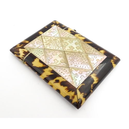 1450 - A Victorian tortoiseshell and mother of pearl card case with engraved floral decoration. Approx. 4