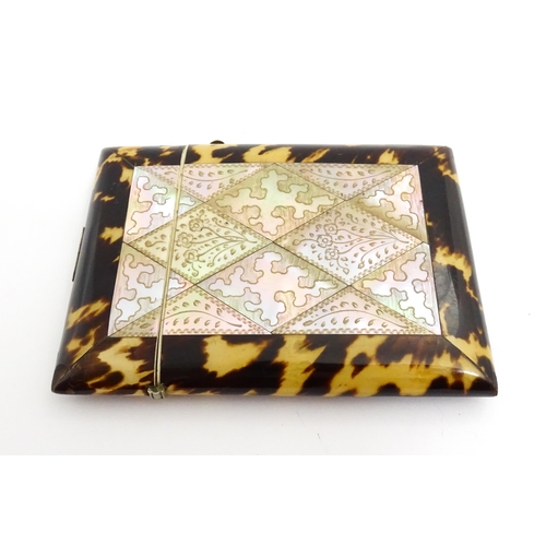 1450 - A Victorian tortoiseshell and mother of pearl card case with engraved floral decoration. Approx. 4