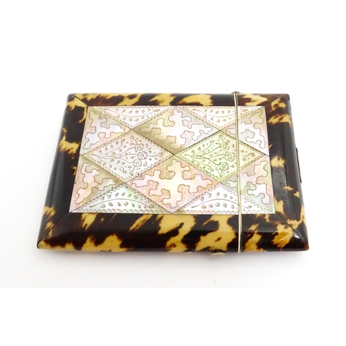 1450 - A Victorian tortoiseshell and mother of pearl card case with engraved floral decoration. Approx. 4