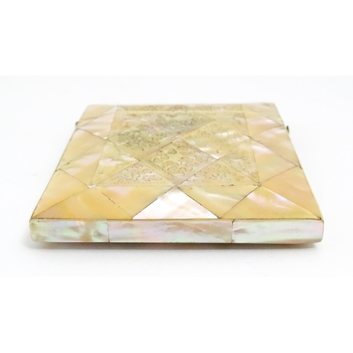 1452 - A Victorian mother of pearl card case with engraved floral decoration. Approx. 4