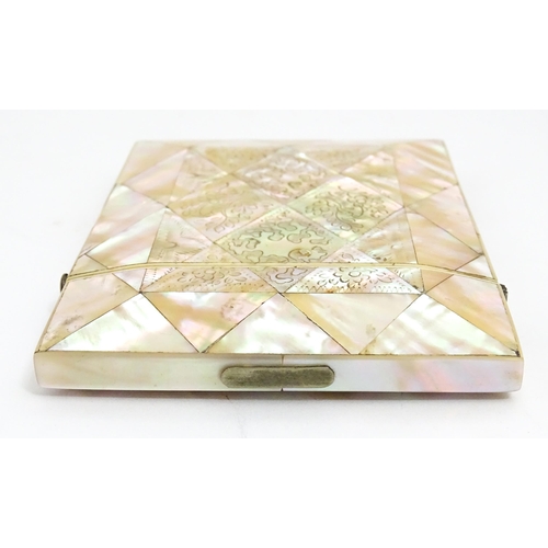 1452 - A Victorian mother of pearl card case with engraved floral decoration. Approx. 4