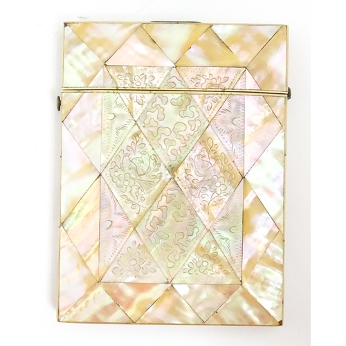 1452 - A Victorian mother of pearl card case with engraved floral decoration. Approx. 4