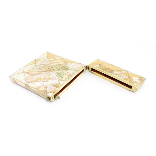 1452 - A Victorian mother of pearl card case with engraved floral decoration. Approx. 4