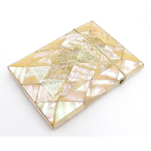 1452 - A Victorian mother of pearl card case with engraved floral decoration. Approx. 4