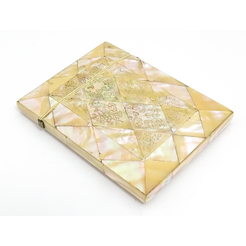 1452 - A Victorian mother of pearl card case with engraved floral decoration. Approx. 4