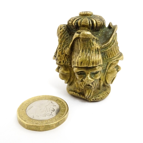 1455 - A 20thC cast brass cane top with multi face detail depicting four military figures. Approx. 1 3/4