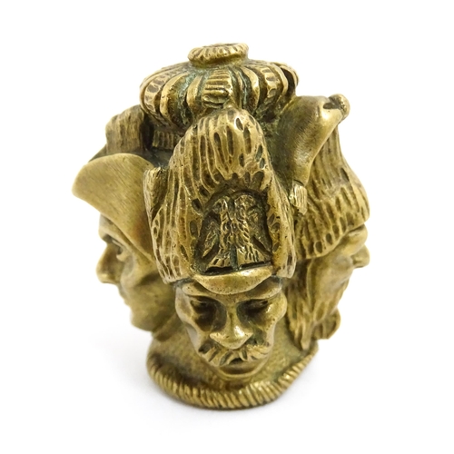 1455 - A 20thC cast brass cane top with multi face detail depicting four military figures. Approx. 1 3/4