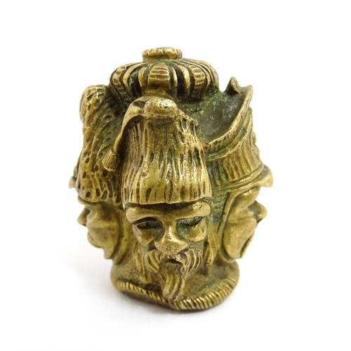 1455 - A 20thC cast brass cane top with multi face detail depicting four military figures. Approx. 1 3/4