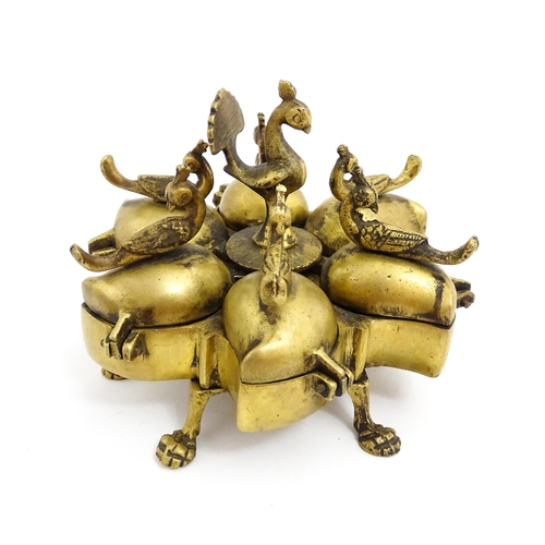 1457 - A 20thC Indian brass travelling spice box comprised of five sections with peacock bird finials, rais... 