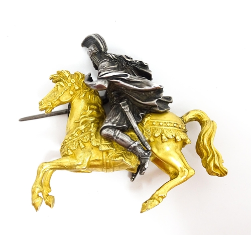 1464 - A late 19th / early 20thC bronze and gilt bronze sculpture modelled as a knight on horseback. Togeth... 