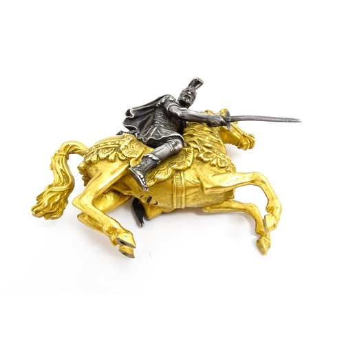 1464 - A late 19th / early 20thC bronze and gilt bronze sculpture modelled as a knight on horseback. Togeth... 